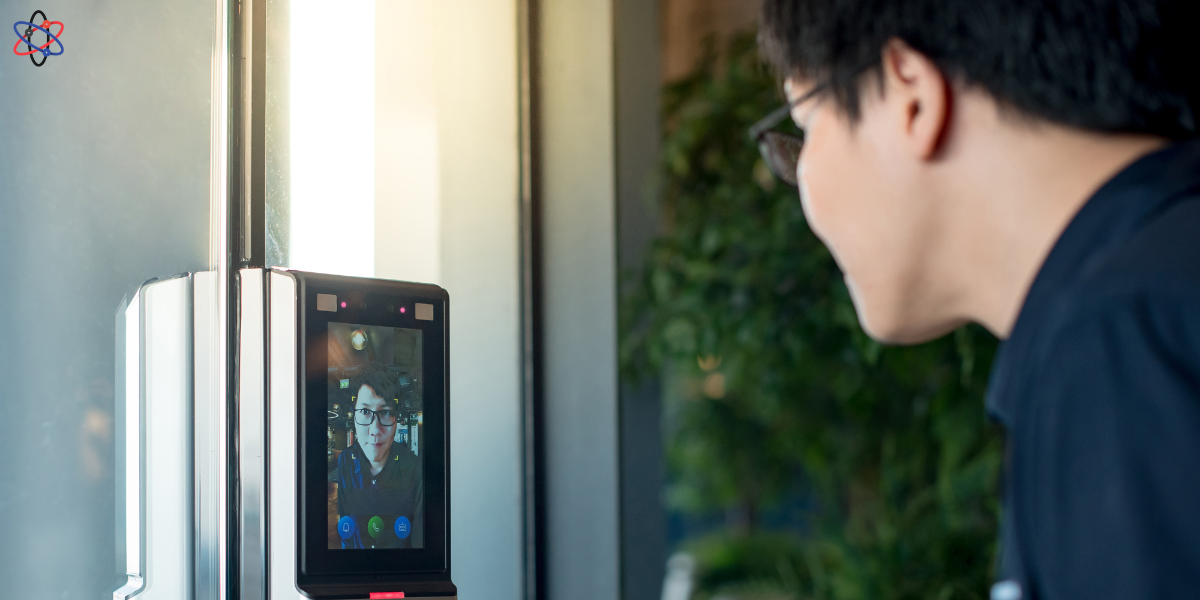 A man observes a video screen mounted on a door, highlighting the importance of access control system maintenance.