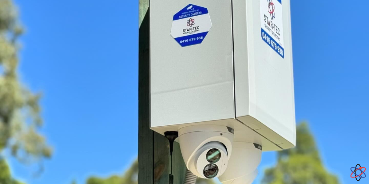 A security camera on a pole against a blue sky, symbolizing tailored solar CCTV solutions for diverse security needs.