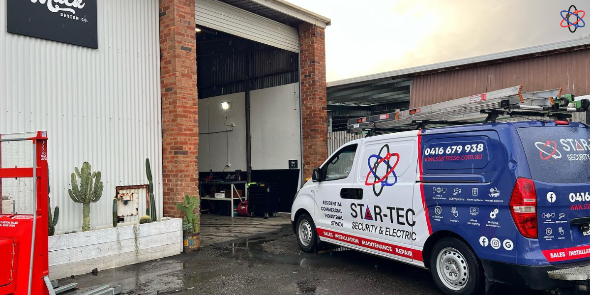 A van parked outside a building with a sign reading "surf - fc," indicating a surf-related business or event.